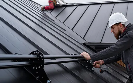 Licensed inspector performing professional roof condition assessment on residential property