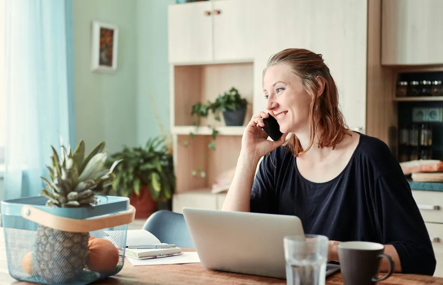 Homeowner on the phone scheduling a free roof inspection with Pinnacle Roofing