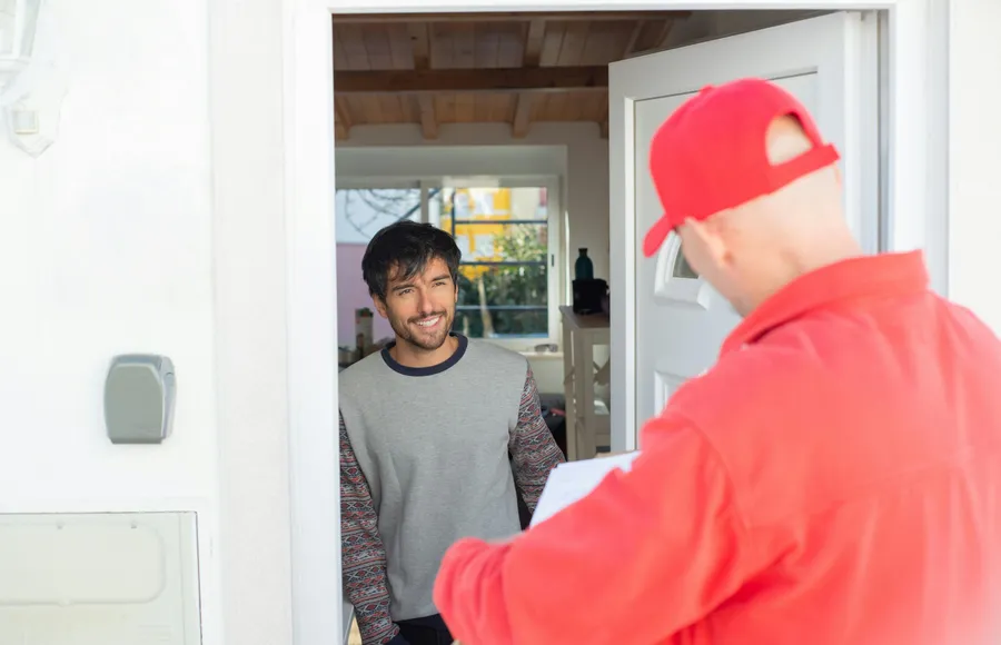 Licensed roofing professional conducting an on-site roof condition assessment